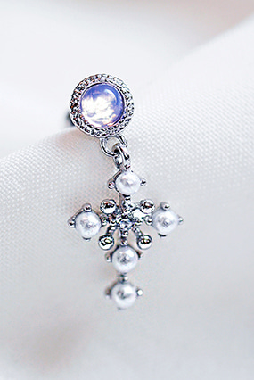 Opal cross piercing